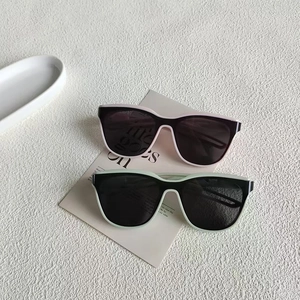 Retro small frame sunglasses for women in pink and mint green with dark lenses