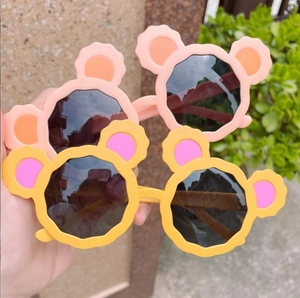Cute cartoon bear ear sunglasses for kids with colorful wavy frames and dark round lenses