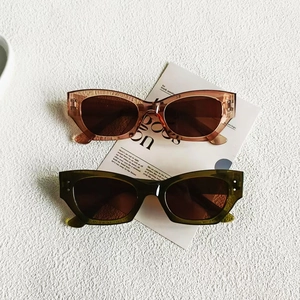 Retro cat-eye tortoiseshell and translucent green sunglasses with UV protection