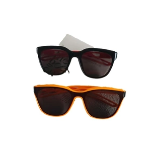 Retro small frame hollow sunglasses in black and bright orange for stylish street wear