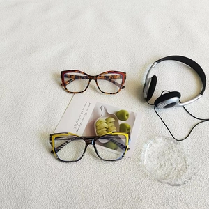 Retro cat eye sunglasses with tortoiseshell pattern and contrast yellow detailing