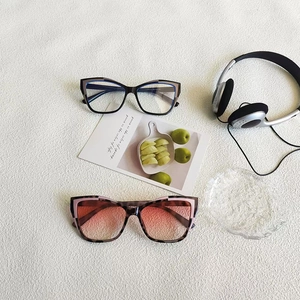Close-up of retro cat-eye sunglasses with tortoiseshell frames and gradient lenses
