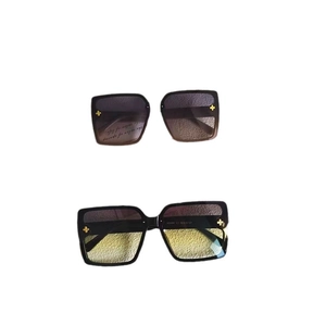 Oversized square fashion sunglasses with hollow metal clover accents and gradient lenses