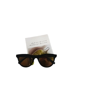 Modern black cat-eye sunglasses with gradient brown lenses and UV400 sun protection