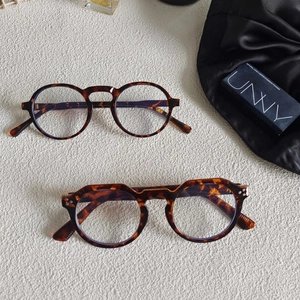 Detail of tortoise shell eyewear frames in classic round and crown panto styles