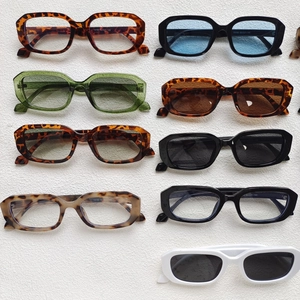 Multiple retro square sunglasses in tortoiseshell, green, black and white frames