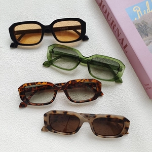 Detail of square frame sunglasses showing temples marked with size code 13153 52-21-145