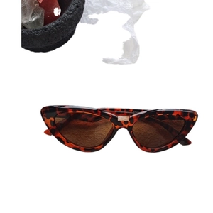 Vintage cat eye sunglasses with tortoiseshell frame and brown lenses in a top view