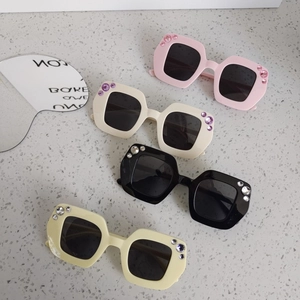 Kids square rhinestone sunglasses in candy colors featuring light pink, beige and black