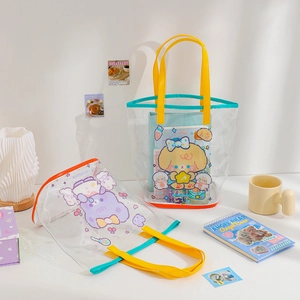 Detail of cute bear cartoon print on transparent PVC jelly bag with yellow handle