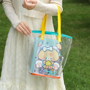 Cute transparent PVC tote bag with colorful handles and a cartoon inner pouch for beach use