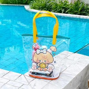 Detail of waterproof cartoon bear mesh beach bag with yellow handles for toiletries