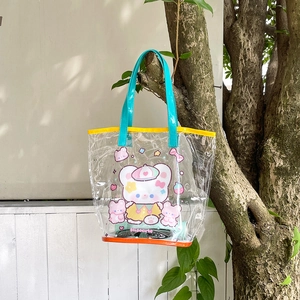 Clear PVC tote bag with cute cartoon bears and stars hanging from a branch