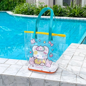 Detail of waterproof cartoon bear mesh beach bag by a swimming pool for summer travel