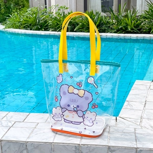 Detailed view of waterproof transparent PVC beach bag with cartoon bear on pool steps
