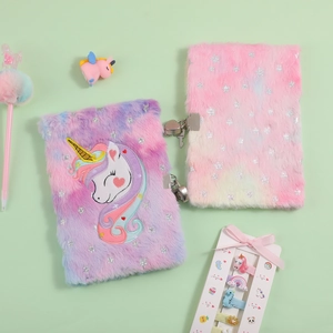 Detail of plush unicorn notebooks with heart locks, fluffy pens, and star sequins