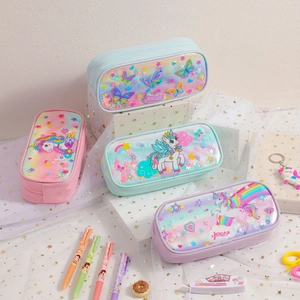 Close-up of cute unicorn pencil cases in pastel macaron colors with glitter sequins
