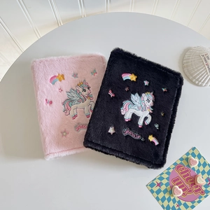 Plush unicorn photo album with colorful embroidery and soft faux fur for collectors