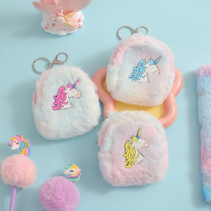 Macro detail of plush unicorn coin purse keychain with pastel gradient fur and metal clasp