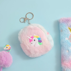 Detail of plush unicorn coin purse with rainbow silicone patch and metal keychain