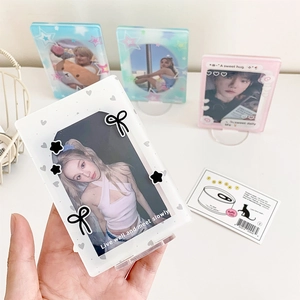 Close-up of pastel acrylic photo frames with cute bow and star patterns for desk display