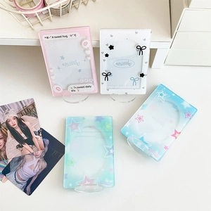 Macro detail of acrylic photocard holders in pink and blue with sweet star patterns