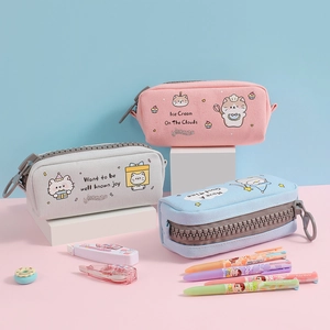 Detail showing high-capacity canvas pencil cases with large zippers and cartoon dog patterns