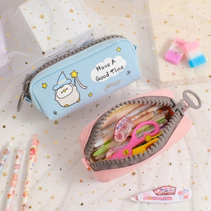Detail view of large zipper pencil cases in blue and pink canvas for stationery storage