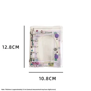 Detail view of mini 6-ring binder with purple button closure and transparent PVC cover
