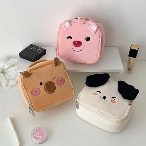 Three cute plush cosmetic bags with animal shapes and top handles for travel storage