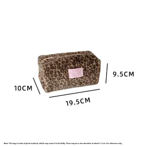 Detail view of plush leopard print makeup bag with dimensions 19.5 x 10 x 9.5 cm