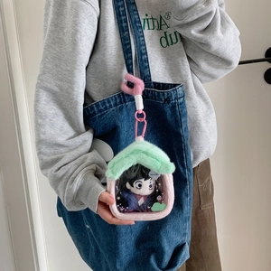 Plush house-shaped doll display bag with transparent PVC window on a blue denim tote