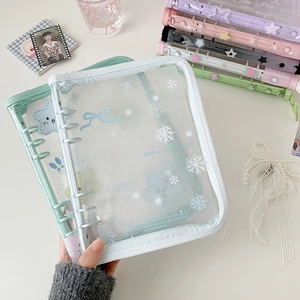 Detail of A5 glitter PVC binder with 6-ring metal clip and cartoon bow butterfly print