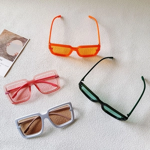 Fashionable rectangle thick frame sunglasses in four colors on a modern white background