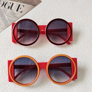 Stylish round oversized sunglasses with thick frames and gradient purple lenses