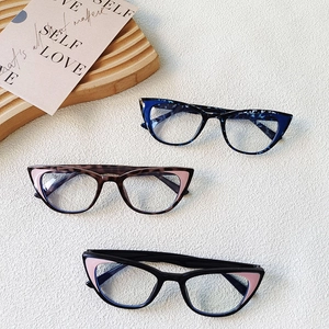 Three pairs of ultra-light cat-eye kids glasses frames in floral and tortoise shell patterns