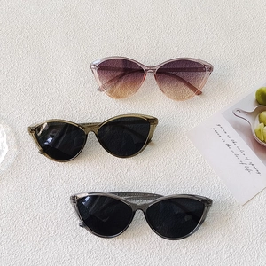 Lightweight cat eye frames in pink, olive, and grey resin finishes for a modern look