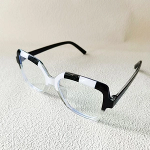 Modern two-tone black and white contrast glasses frame with transparent lower rim for women