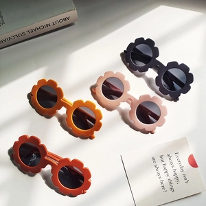 Polarized silicone flower sunglasses for children in four colors on a white background