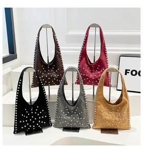 Five colors of rivet bucket bags including brown, burgundy, and black on display