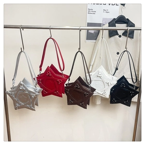Detailed row of star-shaped crossbody bags with metal rivets and decorative leather straps