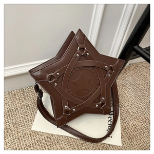Detail of star-shaped brown PU leather shoulder bag with silver rivets and studs