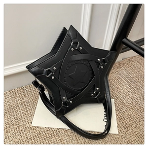 Detail of black star-shaped crossbody bag with silver metal studs and punk style texture
