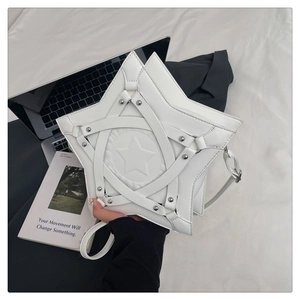 Detail of white star-shaped shoulder bag with metallic rivets and stylish relief pattern