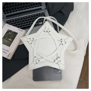 Detailed top view of white star-shaped crossbody bag with metal rivets and lace-up design