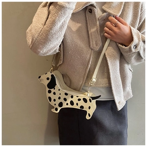 Creative Dalmatian dog crossbody bag shown on model with adjustable strap detail