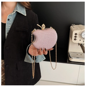 Chic apple-shaped evening clutch with pink glitter texture and gold leaf detail