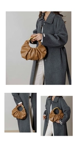Detail of caramel pleated cloud bag featuring premium leather and a golden metal handle