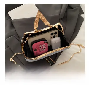 Internal capacity of the satin evening bag showing space for smartphone and accessories