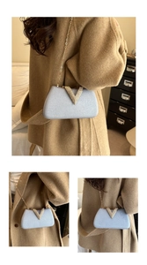 Close-up of light blue glitter evening bag with gold V-shaped crystal clasp and chain